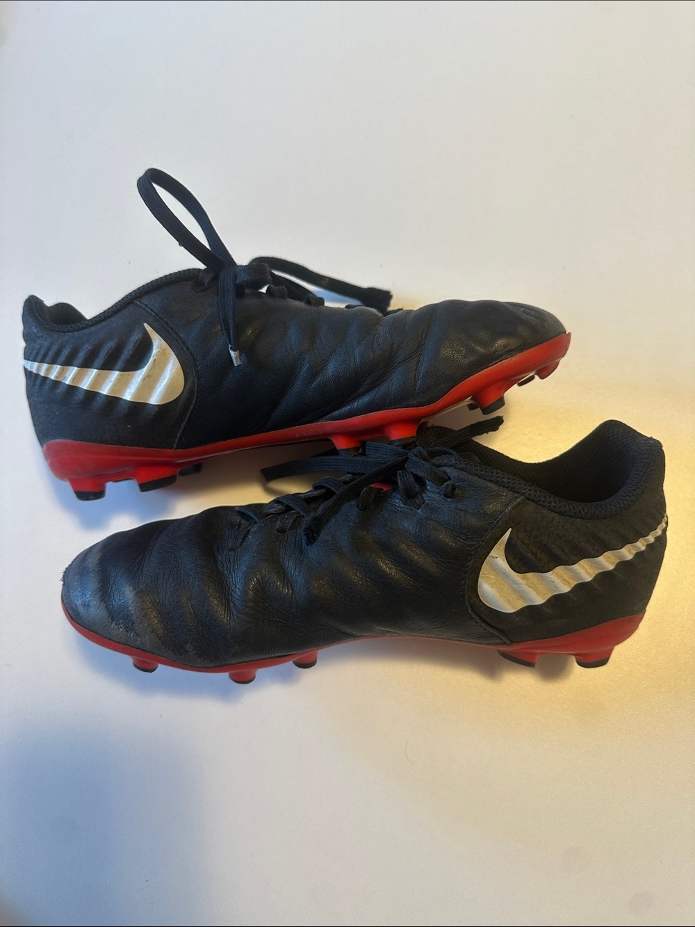 Nike Tempo Kids Black and Red Soccer Cleats with White Swoosh